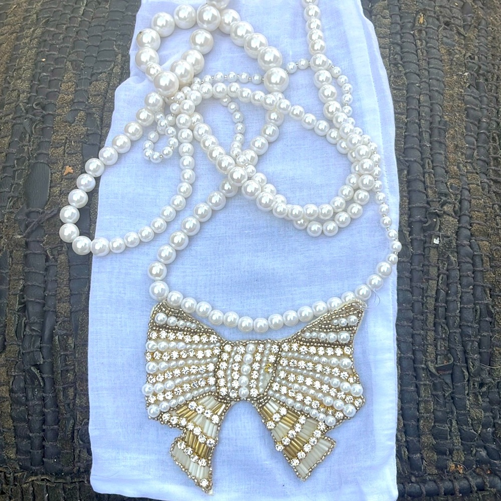 Y & KEI LONG PEARL/BOW NECKLACE